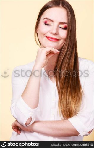 Relaxation, time to think concept. Attractive smiling melancholy woman in brown hair with closed eyes and full makeup thinking and contemplating.. Attractive woman with thinking and contemplating