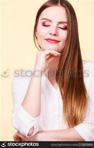 Relaxation, time to think concept. Attractive smiling melancholy woman in brown hair with closed eyes and full makeup thinking and contemplating.. Attractive woman with thinking and contemplating