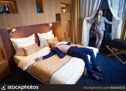 relaxed and happy young couple in modern hotel room