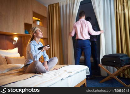 relaxed and happy young couple in modern hotel room