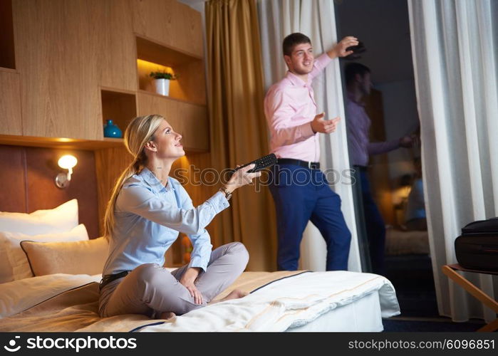 relaxed and happy young couple in modern hotel room