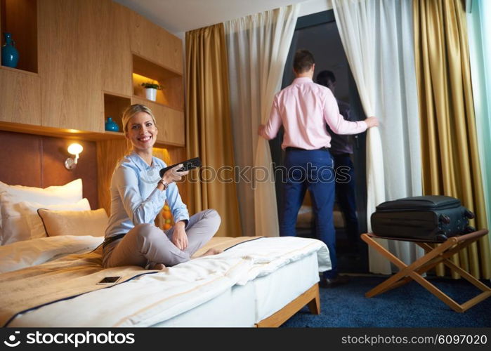 relaxed and happy young couple in modern hotel room