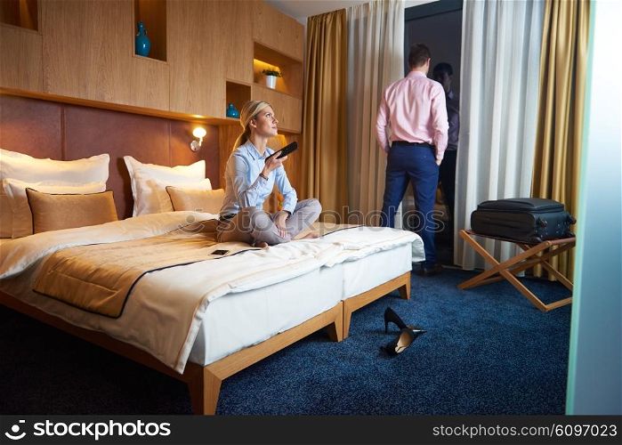 relaxed and happy young couple in modern hotel room