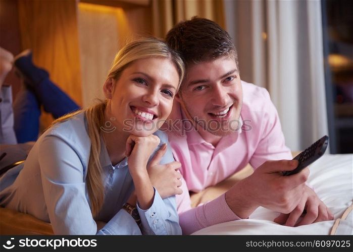 relaxed and happy young couple in modern hotel room
