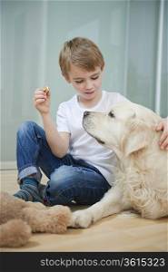 Relaxed boy sitting with his dog on floor