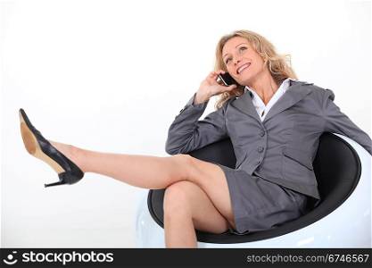 relaxed businesswoman on the phone