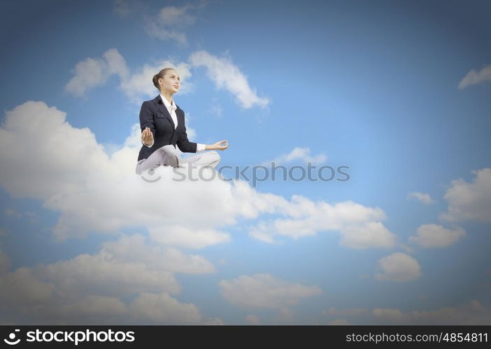 Relaxed businesswoman. Young attractive lady sitting on cloud and practicing yoga