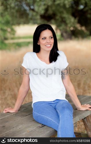 Relaxed cool girl with casual wear in a beautiful park