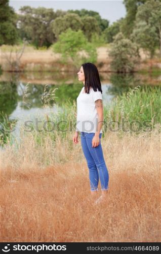 Relaxed cool girl with casual wear in a beautiful park