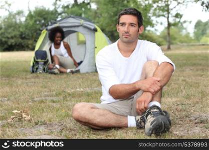 Relaxed couple camping