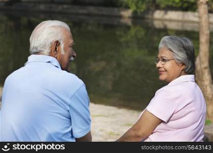 Relaxed couple spending time at park