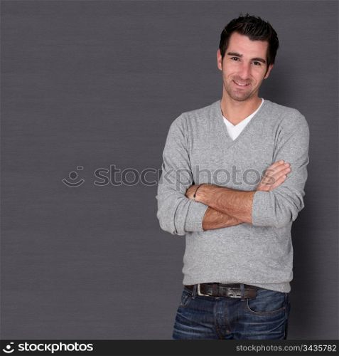 Relaxed handsome guy on dark background