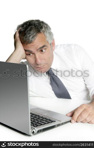 relaxed senior businessman looking laptop computer white desk background