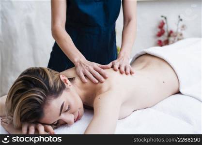 relaxed woman enjoying back massage