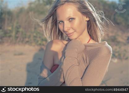 Relaxed woman enjoying sun, freedom and wind in sand dunes. Young girl feel freedom, relaxation and happiness. Vacation well being concept.. Relaxed woman enjoying sun, freedom and wind in sand dunes. Young girl feel freedom, relaxation and happiness. Vacation well being concept. Retro color.