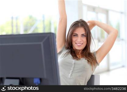 Relaxed young woman at work