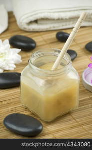 relaxing aroma of almond coconut vanilla milk and honey bath foam over wooden mat