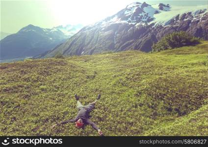 Relaxing backpacker in mountains. Instagram filter.