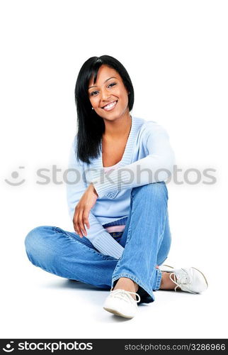 Relaxing black woman sitting on floor isolated on white background