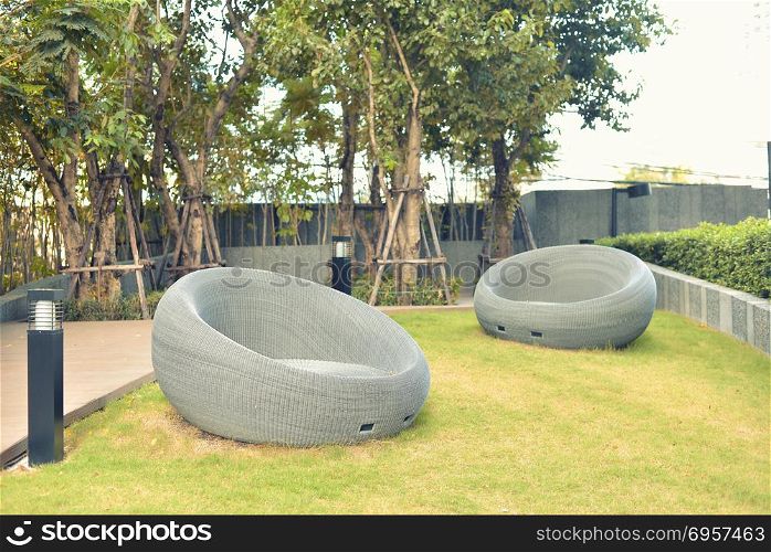 Relaxing Rattan Sofa in a garden, outdoor object