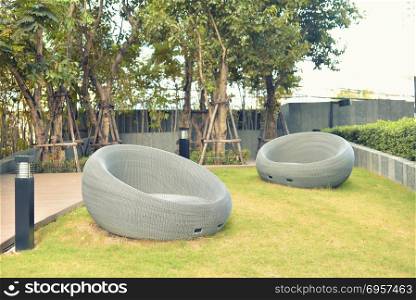 Relaxing Rattan Sofa in a garden, outdoor object