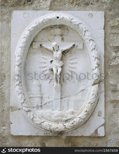 Relief sculpture of Crucifixion in Lisbon, Portugal.
