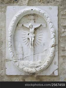Relief sculpture of Crucifixion in Lisbon, Portugal.