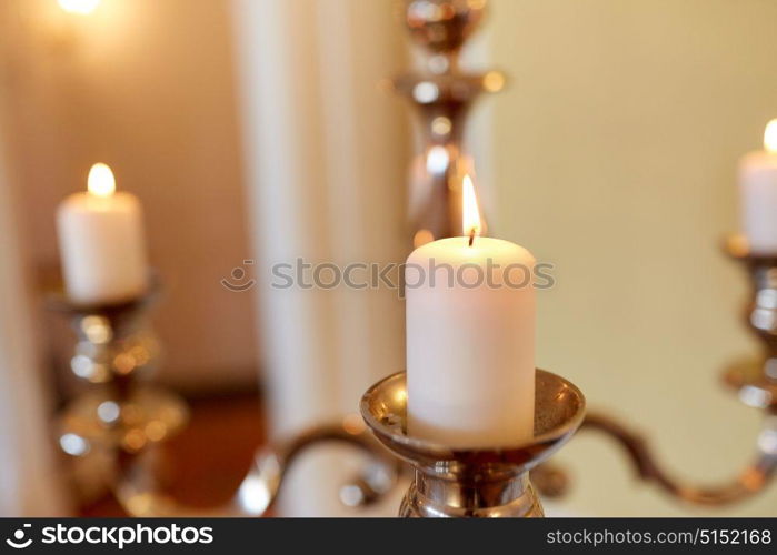 religion concept - candles burning in church. candles burning in church