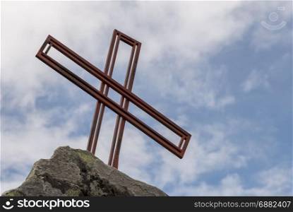 religion cross as monument on a rock in norway