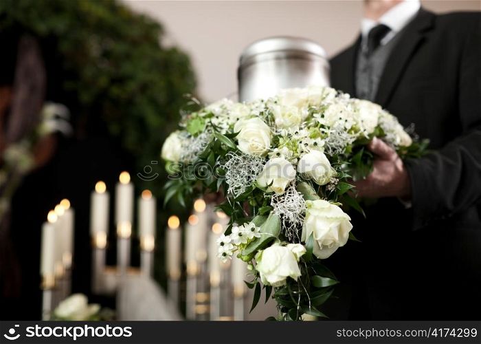Religion, death and dolor - funeral and cemetery; urn funeral