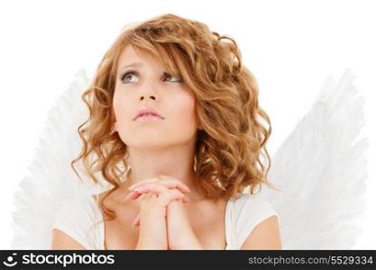 religion, faith, holidays and costumes concept - praying teenage angel girl