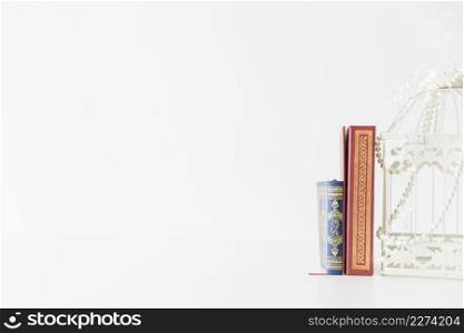 Religious books standing with bird cage Picture on . Resolution and high quality beautiful photo. Religious books standing with bird cage Picture on . High quality beautiful photo concept