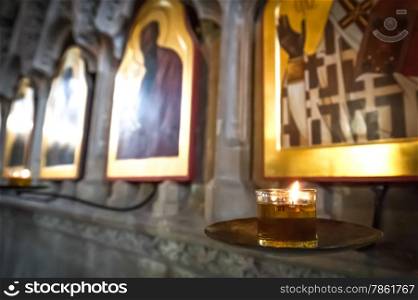 religious icons illuminated by a flickering candlelight
