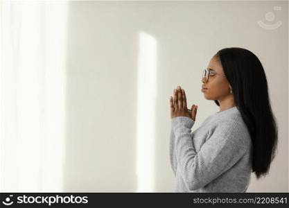 religious woman praying home