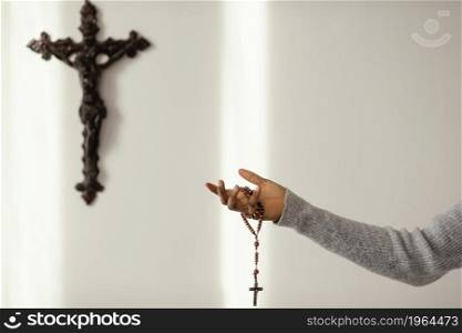 religious woman praying with rosary beads home. High resolution photo. religious woman praying with rosary beads home. High quality photo