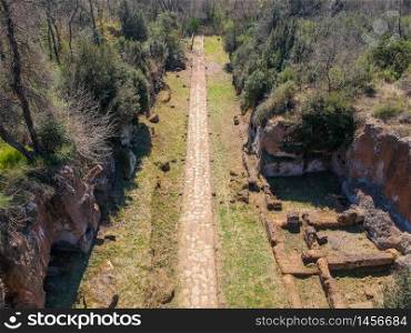 Remains of Etruscan tombs on the sides of road Amerina. Aerial View