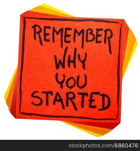 Remember why you started - handwriting in black ink on an isolated sticky note