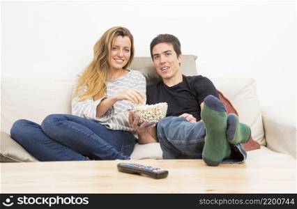 remote control front couple eating popcorn