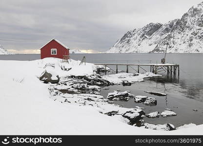 Remote house in coastal landscapeSkjelfjord Flakstadoya Loftofen Norway