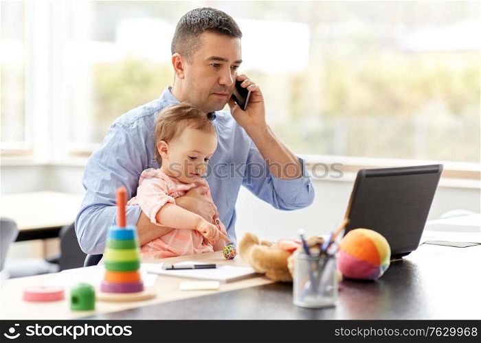 remote job, multi-tasking and family concept - middle-aged father with baby and laptop calling on smartphone at home office. father with baby calling on phone at home office