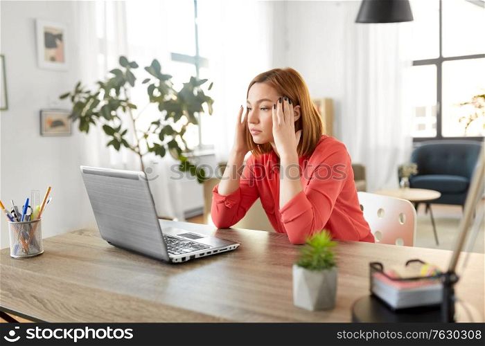 remote job, technology and people concept - tired or stressed young woman with laptop computer working at home office. stressed woman with laptop working at home office
