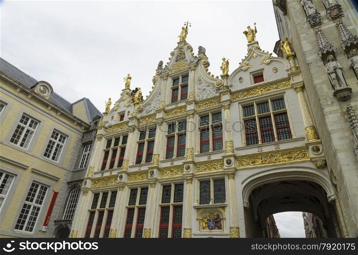 Renaissance Aaron Civil Registry date 1543, and an entrance to Burg Square, Square. Bruges, West Flanders, Belgium, Europe