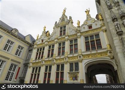 Renaissance Aaron Civil Registry date 1543, and an entrance to Burg Square, Square. Bruges, West Flanders, Belgium, Europe