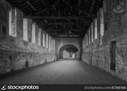 "Renaissance building called "Covered Road",Vigevano,north of Italy,black and white photo."