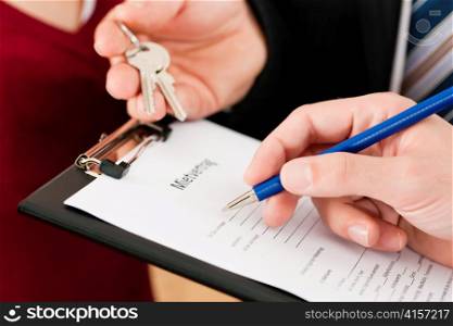 Rent an apartment - Signing tenant agreement; close-up on form