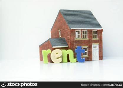Rent lease house concept with model house and letters