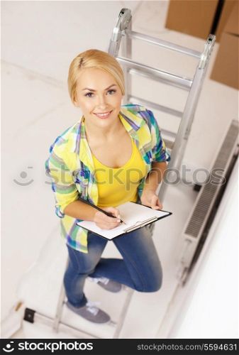 repair, building and home concept - smiling woman with clipboard