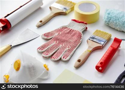 repair, building and renovation concept - different painting work tools on white background. different painting work tools on white background