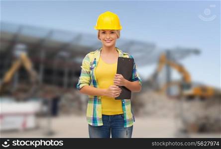 repair, building, construction and maintenance concept - smiling woman in helmet with clipboard