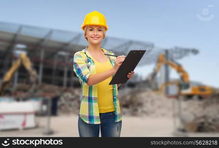 repair, building, construction and maintenance concept - smiling woman in helmet with clipboard making notes